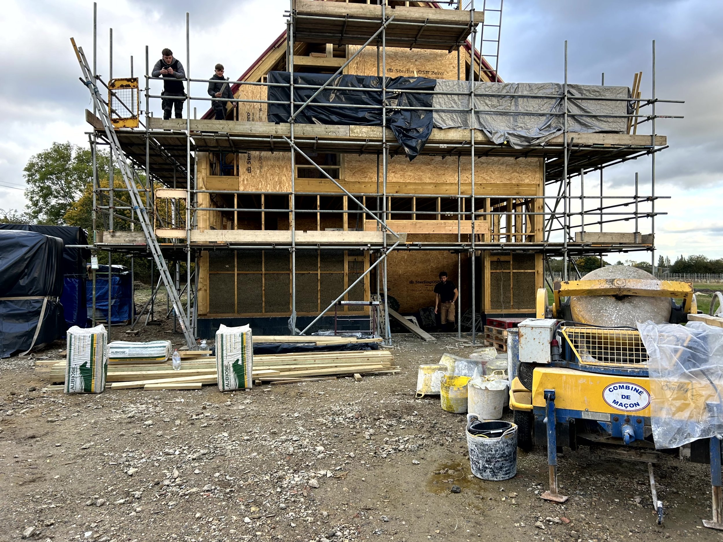 Sprayed hempcrete walls in a plain room corner with a single window